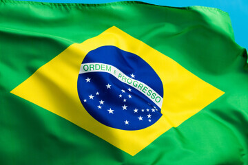 Brazil flag waving on blue background