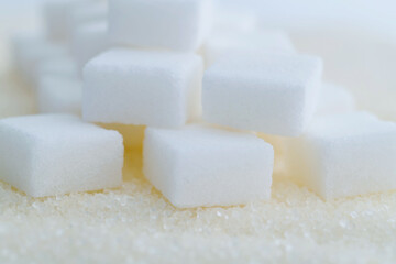 Sugar cubes on top of granulated sugar