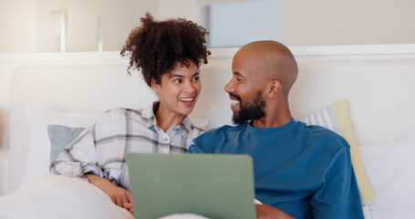 Home, bed and black couple with a laptop, love or smile with website for comedy, internet or streaming a movie. Bedroom, apartment or man with woman, connection or film with romance, happy or bonding