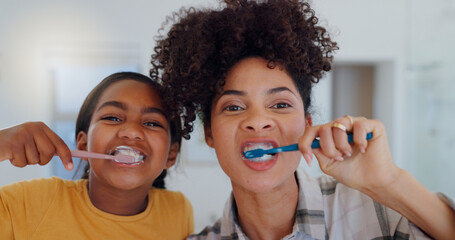 Portrait, bathroom and mother brushing teeth with child for oral health and wellness at home....
