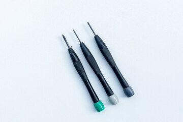 Slotted screw driver set isolated on white background. Top view, copy space. 