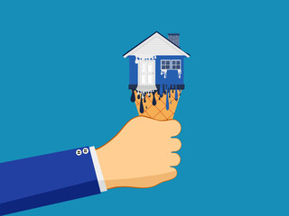 Fototapeta na wymiar Real estate depreciates. The hand holding the house melted like ice cream. vector illustration