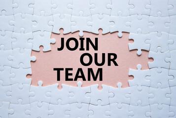 Join our team symbol. Concept words Join our team on white puzzle. Beautiful pink background....