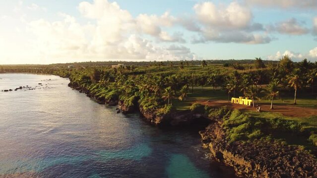 Drone shot of Taga beach at Tinian island during a golden hour