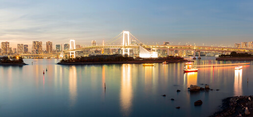 Fototapeta premium Cityscape View of Tokyo Bay, Rainbow bridge and Tokyo Tower landmark, Twilight scene, Odaiba, Japan