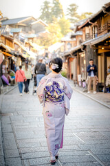 Japanese Kimono Portrait back view photography. Kyoto, Japan. Japanese traditional buildings background.