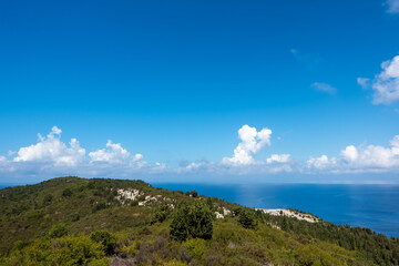 Stunning view down to the sea and the surrounding area from top of the mountain in Ereikoussa island, Greece