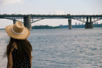Novosibirsk City woman looking at Bridge and view of downtown Manhattan skyline from Brooklyn urban...