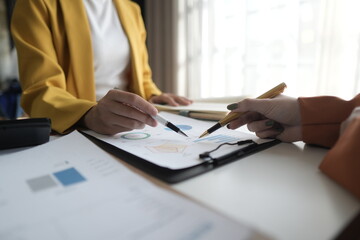 Business People Meeting to discuss and brainstorming the financial report paperwork in home office