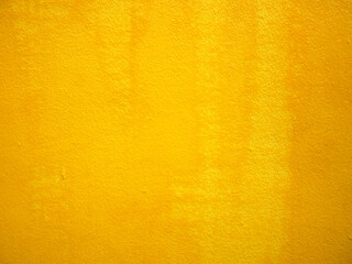 Close up texture orange color paint brush background. Painted wall with traces of brushes.