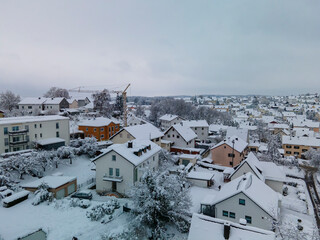 Fototapeta na wymiar Bavarian Snow City Shape with dark snow clouds at the background