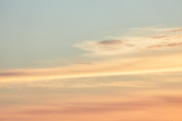 A beautiful sky tinted by the sun leaving vibrant shades of gold, pink, blue and multicolored. Clouds in the twilight evening and morning sky. Image of a cloudy sky in the evening and during the day