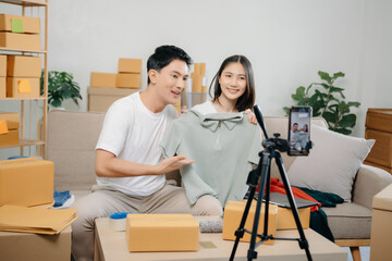 Small business entrepreneur SME freelance Asian man and woman working at home office, BOX, tablet and laptop online, marketing, packaging, delivery.