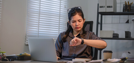 Puzzled confused asian woman thinking hard concerned about online problem solution looking at...