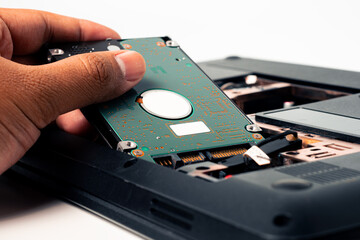 Close-up of a computer hard drive on a white background.