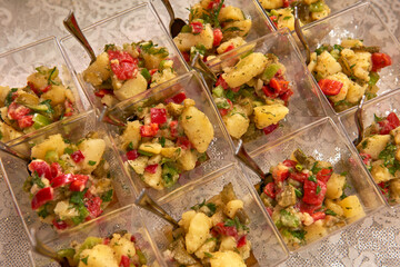 Potato and carrot salad, engagement dinner presentation on the table style, portion.