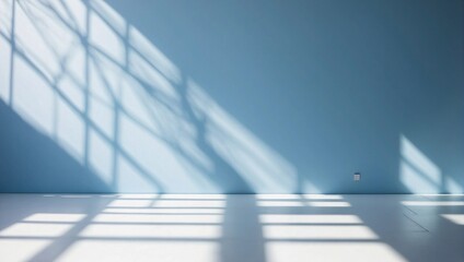 Empty room with blue walls, wooden floor and light shadow from the window, seen from the front. Modern minimalist background for product presentation or display	