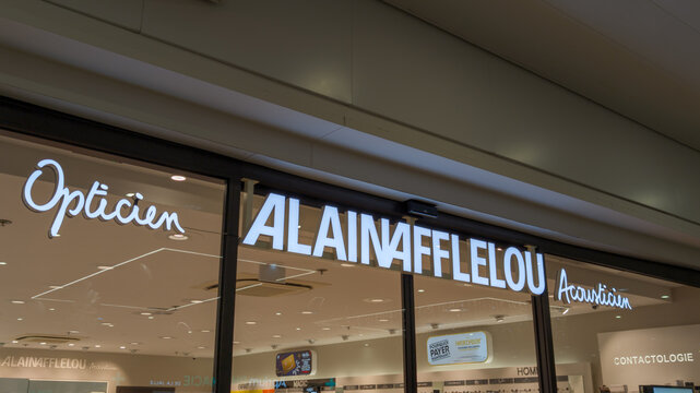 alain afflelou text logo and sign chain facade windows shop medical brand on wall entrance optic medic glasses store