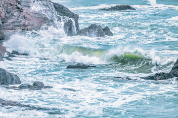 Wave splashing close-up. Crystal clear sea water, in the ocean in San Francisco Bay, blue water, pastel colors.