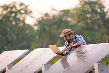 Male farmer checks the readiness of solar cells for agriculture.