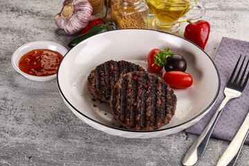Grilled burger cutlet with sauce