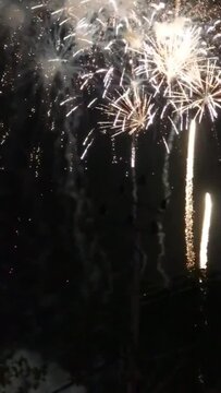 Happy New Year 2024 fireworks and golden new year 2024 celebration vertical video
