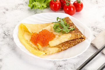 Russian pancake with red caviar