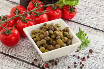 Marinated green capers in the bowl