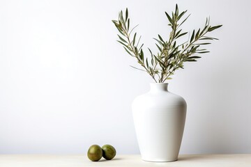 Textured design vase, pot with olive tree branches on a wooden shelf. Monotone wall background with copy space, blank, frame. Mediterranean interior inspiration.