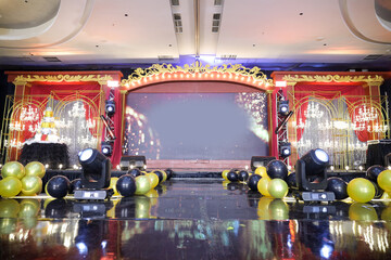 A colorful venue stage set decoration with lighting and led big screen for sweet17th birthday party...