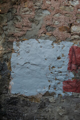 Ancient wall background with old painted concrete bricks