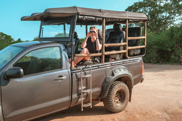 Safari trip.Wildlife safari.Eco travel in the jungle with wild animals elephants.Tropical tourism...
