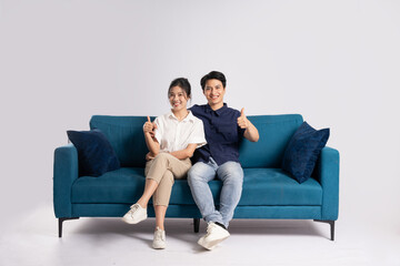 Image of an Asian couple posing on a white background