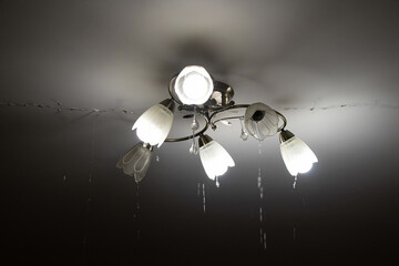 Due to a broken pipe, there was a flood in the upstairs apartment and water was flowing from the...