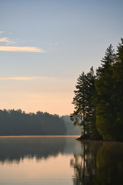 on a lake in Sweden in Smalland. Rock in foreground, blue water, sunny sky,
