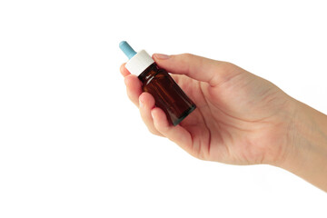 Hand holds a bottle of nasal drops isolated on white background. Space for text