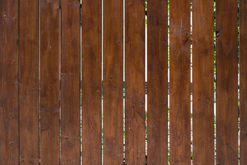 Wooden boards on the fence as a background.