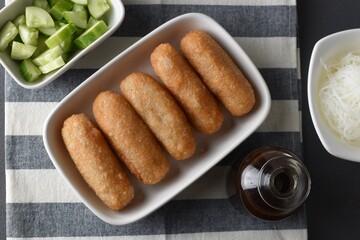 Pempek  on white plate with vermicelli and cuko sauce. Pempek, mpek-mpek or empek-empek is a savory Indonesian fishcake delicacy, made of fish and tapioca, from Palembang, South Sumatera, Indonesia.