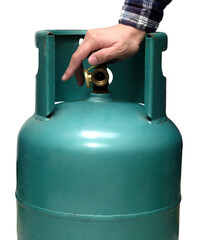 Male hand is closing the valve of lpg gas tank for safety. Files can use clipping parts.