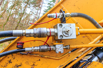Components of a hydraulic arm of a grab excavator, connectors, hoses, cables, couplings, cylinder...