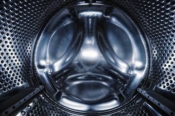 Washing Dryer Machine inside view. Washing machine drum, view from the inside. Metal drum of a...