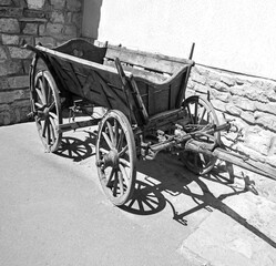 Fototapeta na wymiar Old wooden cart on the square