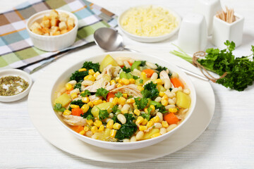 Fototapeta na wymiar Chicken and white bean soup with veggies, corn