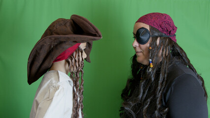 Family pirate game. Mom and son pirates looking at each other. High quality photo