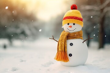 Snowman in the snow, wearing a yellow and red scarf