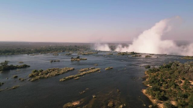 Spray of Victoria Falls seen from Zambezi River, Zimbabwe