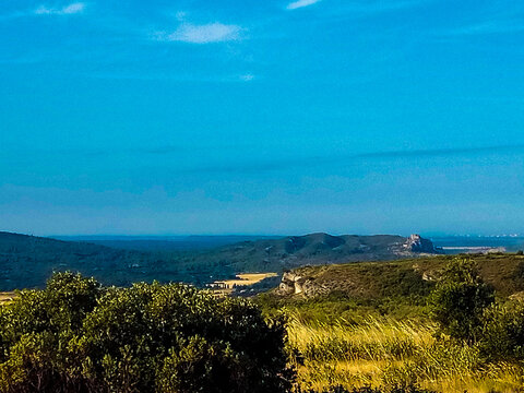 Beautiful landscape of the Eygui&egrave;res hills on a summer morning from the Orgon plateau