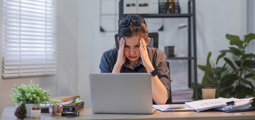 Puzzled confused asian woman thinking hard concerned about online problem solution looking at laptop screen, worried serious asian businesswoman focused on solving difficult work computer task