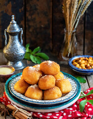 A plate of traditional Moroccan and North African sfenj in a rustic setting.