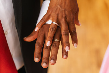 Black ethnic couple embracing with ring at a beautiful wedding, marriage ceremony